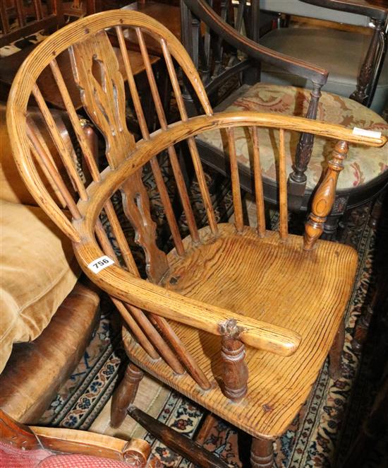 An early 19th century ash and elm hoop back elbow chair